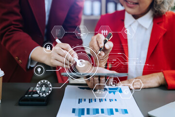 Wall Mural - Copyright or patent concept, Business team analyzing data and using smart phone and tablet with virtual screen copyright icon trademark license, Creation ownership against piracy.