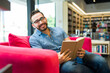 © AntonioDiaz - Cheerful man having fun reading a book
