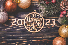 Happy New Year 2023 On Wooden Brown Background
