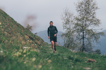 Wall Mural - man running in the mountains