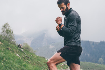 Wall Mural - Man running in the mountains