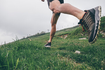 Wall Mural - man running in the mountains
