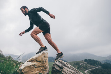 Wall Mural - man running in the mountains