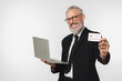 © InsideCreativeHouse - Successful caucasian mature middle-aged businessman ceo boss bank employee worker using laptop for e-banking, e-commerce, holding credit card with copy space free space mockup isolated
