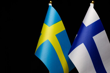 Flags of Sweden and Finland, close together, concept of state relations