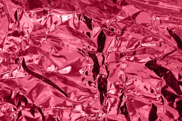 Crumpled foil colorful backdrop. Abstract background. Color of the year 2023 inspired