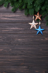 Wall Mural - Winter background with fir branches and Christmas decorations in form of star