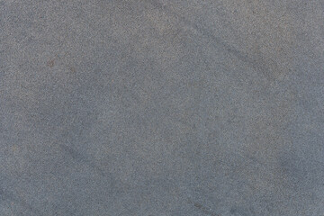 Grey asphalt texture close up