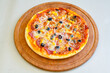 © enderbayindir - Delicious mixed pizza with rich content. Menu concept of choice and diversity. Karisik pizza