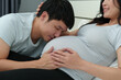 © geargodz - Husband kissing to pregnant wife's belly
