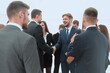 © ASDF - welcome and handshake of business partners in the office.