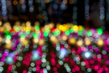 Wall Mural - Blurred and bokeh of Christmas holiday lightings pattern background