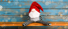 Christmas Gnome On Blue Wooden Background