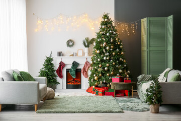 Poster - Interior of living room with electric fireplace and Christmas trees