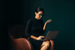 © Jacob Lund - Businesswoman using mobile phone and using laptop