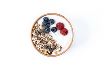Wall Mural - Yogurt with berries and muesli for breakfast in bowl