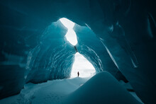 Person Is Standing In Beautiful Ice Cave In Vatnajkull Glacier Iceland In The Winter