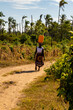 Woman carrying a water canister on her head