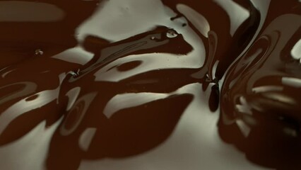 Wall Mural - Super Slow Motion of mixing Dark Melted Chocolate. Filmed with High Speed Cinema Camera, 1000fps. 