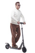 © ASDF - in full growth. casual adult male with electric scooter.