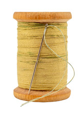 Old Wooden Spool Of Thread And Needle