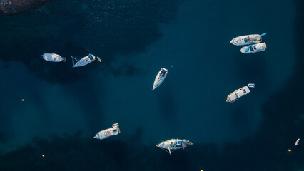 4k aerial images of land and sea with ships off the coast of Europe.