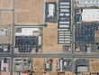 Victorville, California – April 15, 2021: straight down aerial drone view of Victorville above Bear Valley Rd with shopping malls, commercial buildings, vacant lands.