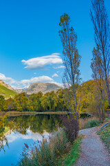 Wall Mural - Landscape in the French southern alps in the middle of a large valley in autumn with a lake 