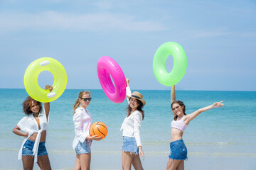 Wall Mural - Young friends have fun on the beach,Concept vacation,Holiday in summer.