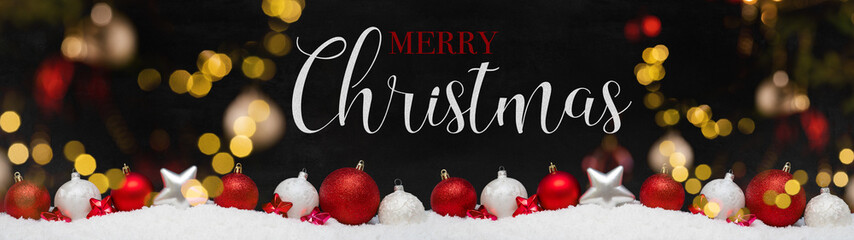 Wall Mural - Merry Christmas ornaments advent celebration holiday holidays banner greeting card panorama long - Red and white christmas baubles, balls and stars on snow, with black concrete wall in background