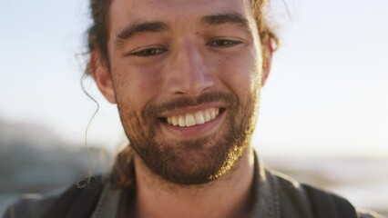 Wall Mural - Face, travel and beach with a man outdoor alone in nature for tourism, adventure or lifestyle. Portrait, happy and smile with a handsome young male tourist by the sea or ocean on the Mexico coast