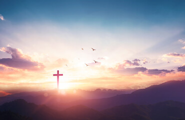 Wall Mural - christian wooden cross on sunset background.