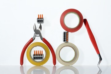 Wall Mural - Different tools for electronics repair laid out on a white background