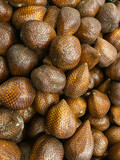Salacca zalacca, Salak fruit. Pile of snakefruit or zalacca or salak in the market.