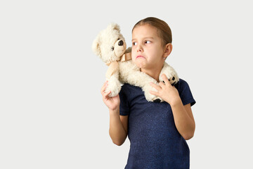 Wall Mural - Portrait of little girl with white toy bear