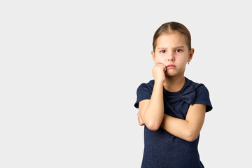 Portrait of a unhappy sad girl, white background