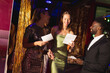 © Wavebreak Media - Happy, diverse doorman and two female friends greeting and passing invites at a nightclub entrance