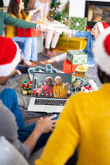 Poster - Diverse friends with christmas decorations having video call with happy diverse couple