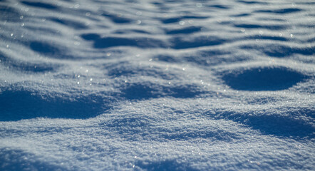 Wall Mural - winter snow background - snow covered surface and artistic bokeh