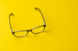 © vectorfusionart - Composition of glasses on yellow background