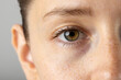 © vectorfusionart - Close up of eye of caucasian woman on grey background