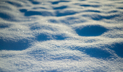 Wall Mural - winter snow background - snow covered surface and artistic bokeh