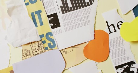 Wall Mural - Video of close up of collage of scraps of paper and newspaper on yellow background