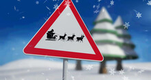 Image Of Snow Falling Over Road Sign With Santa Claus In Sleigh With Reindeer In Winter Scenery