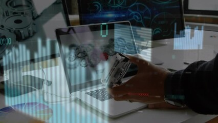 Poster - Animation of financial data processing over caucasian businessman using laptop in office