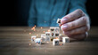 © Barriography - Hand arrange wood block stacking with business strategy and Action plan, target development, icon of element with goal, idea, leadership, management of time, Knowledge, Initiative, Human relation.