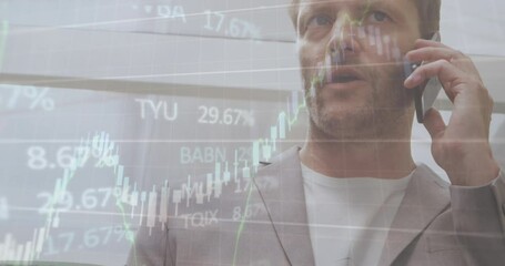 Poster - Animation of financial data processing over caucasian businessman talking on smartphone at office