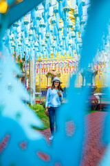 Sticker - Asian female tourists while touring the Lanna style festival in Lamphun province