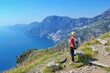 Woman hiker watching beautiful costal scenery - Path of the Gods 