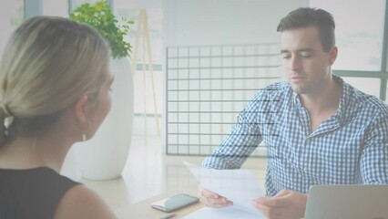 Canvas Print - Animation of statistical data processing over caucasian man and woman discussing at office